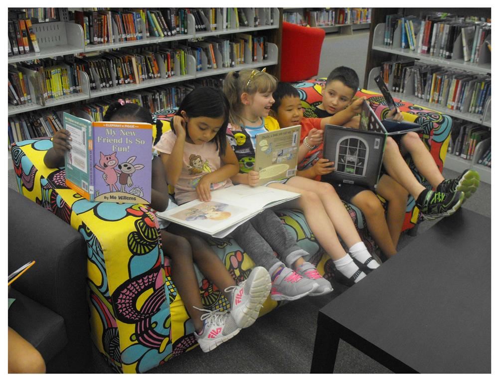 Students reading in the media center Students reading in the media center